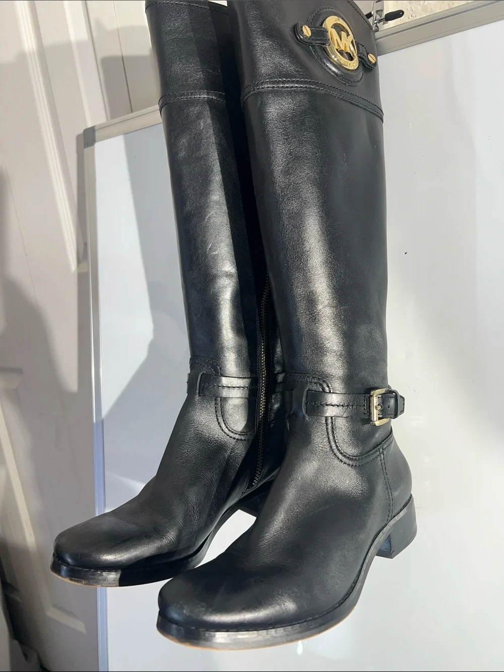 Knee-high leather boots with MK logo